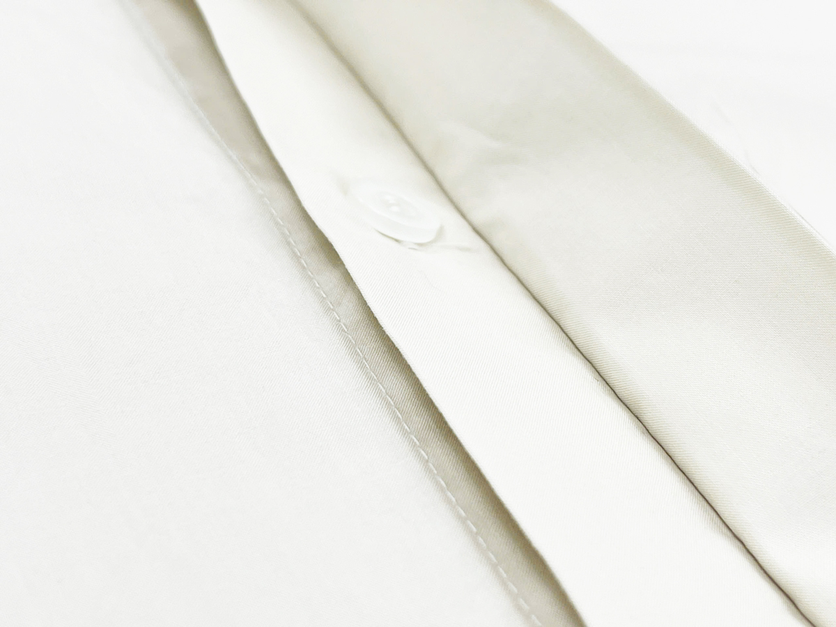 The hidden button placket creates a sleek and minimalistic look, enhancing the shirt’s refined and premium appearance.