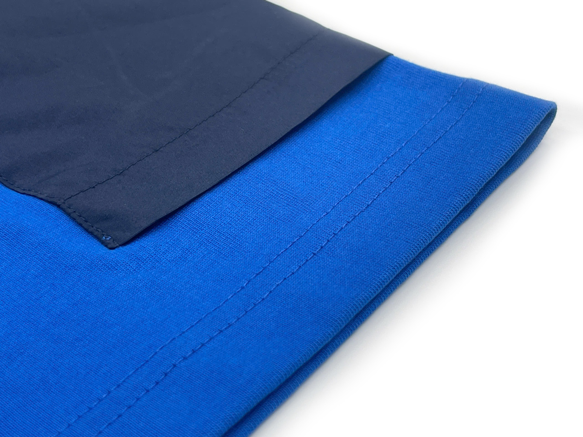 The sleeves feature a raglan design that enhances mobility and all-day comfort.