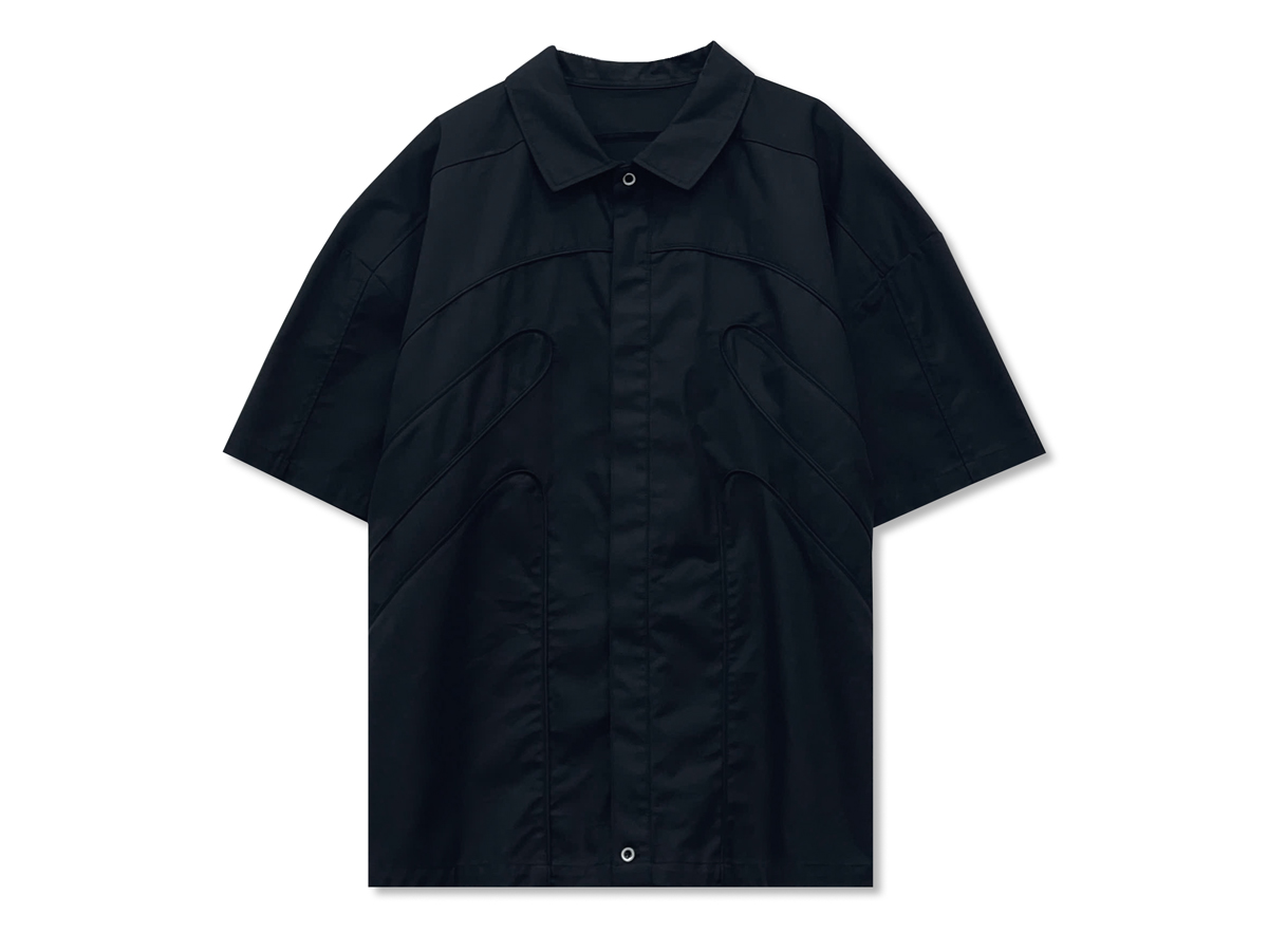 This relaxed-fit shirt, featuring a front button closure, is crafted from lightweight, breathable nylon.
