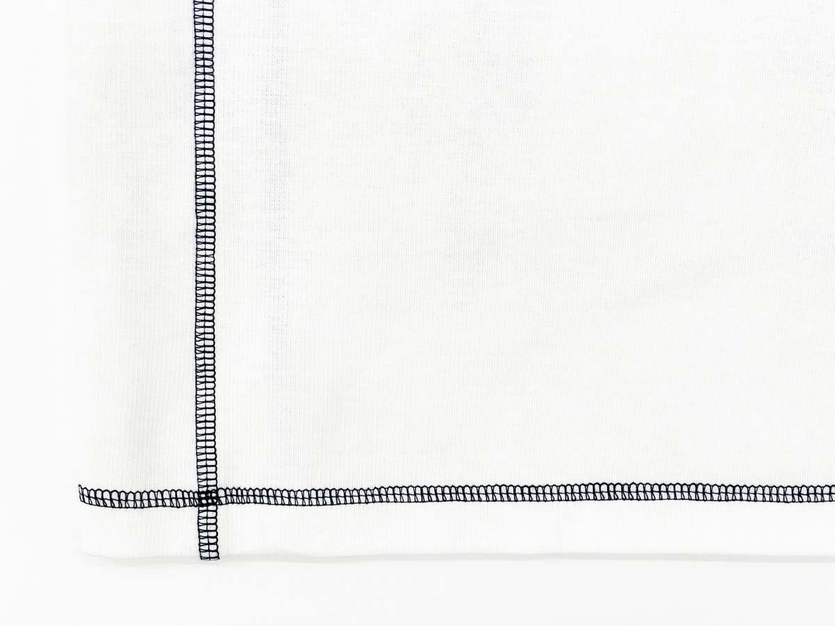 The back of the dress is accentuated with reverse seam detailing, creating a unique visual effect while enhancing body contours.