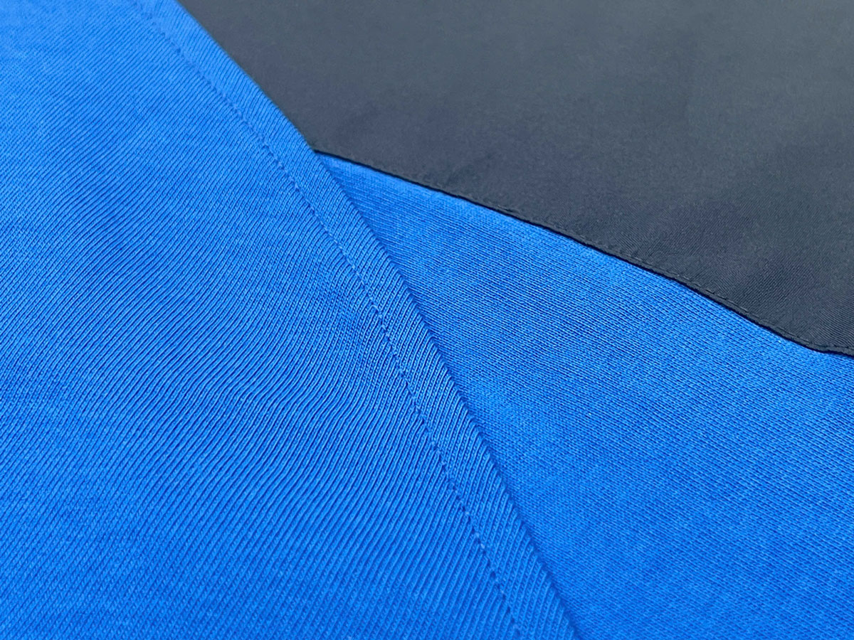 The underarm area is crafted with a raglan cut