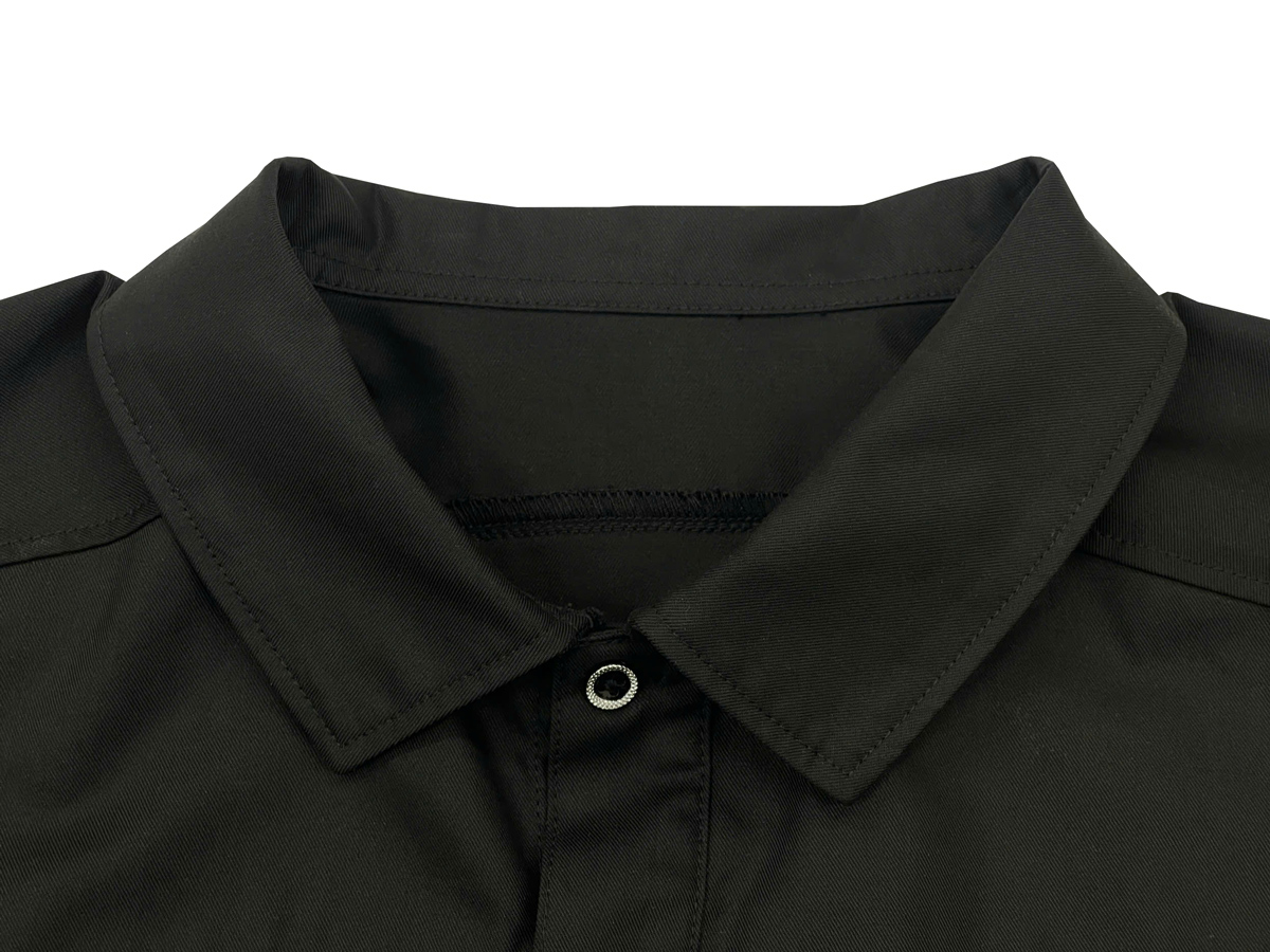 The shirt features a spread collar with secure stitching for a modern shape.