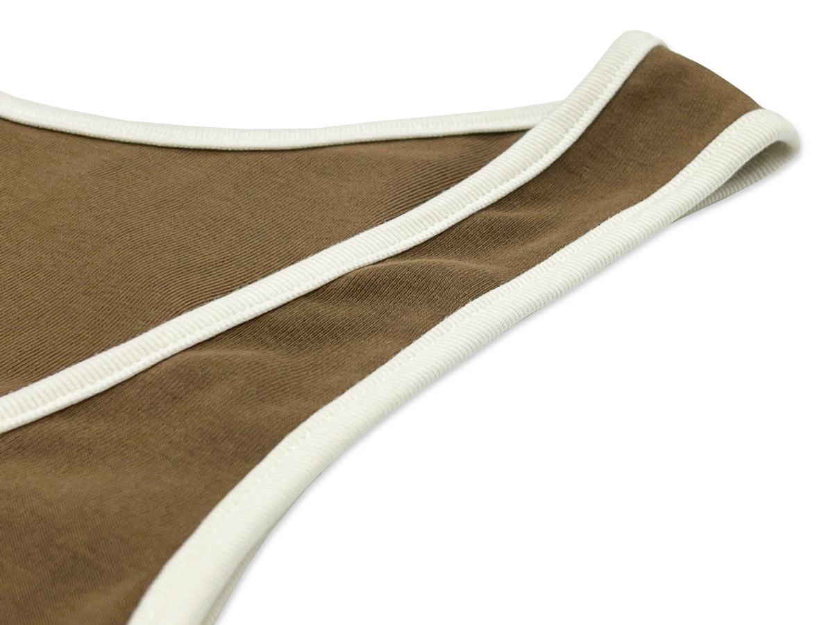 The armhole design is moderately wide, ensuring comfort and ease of movement.