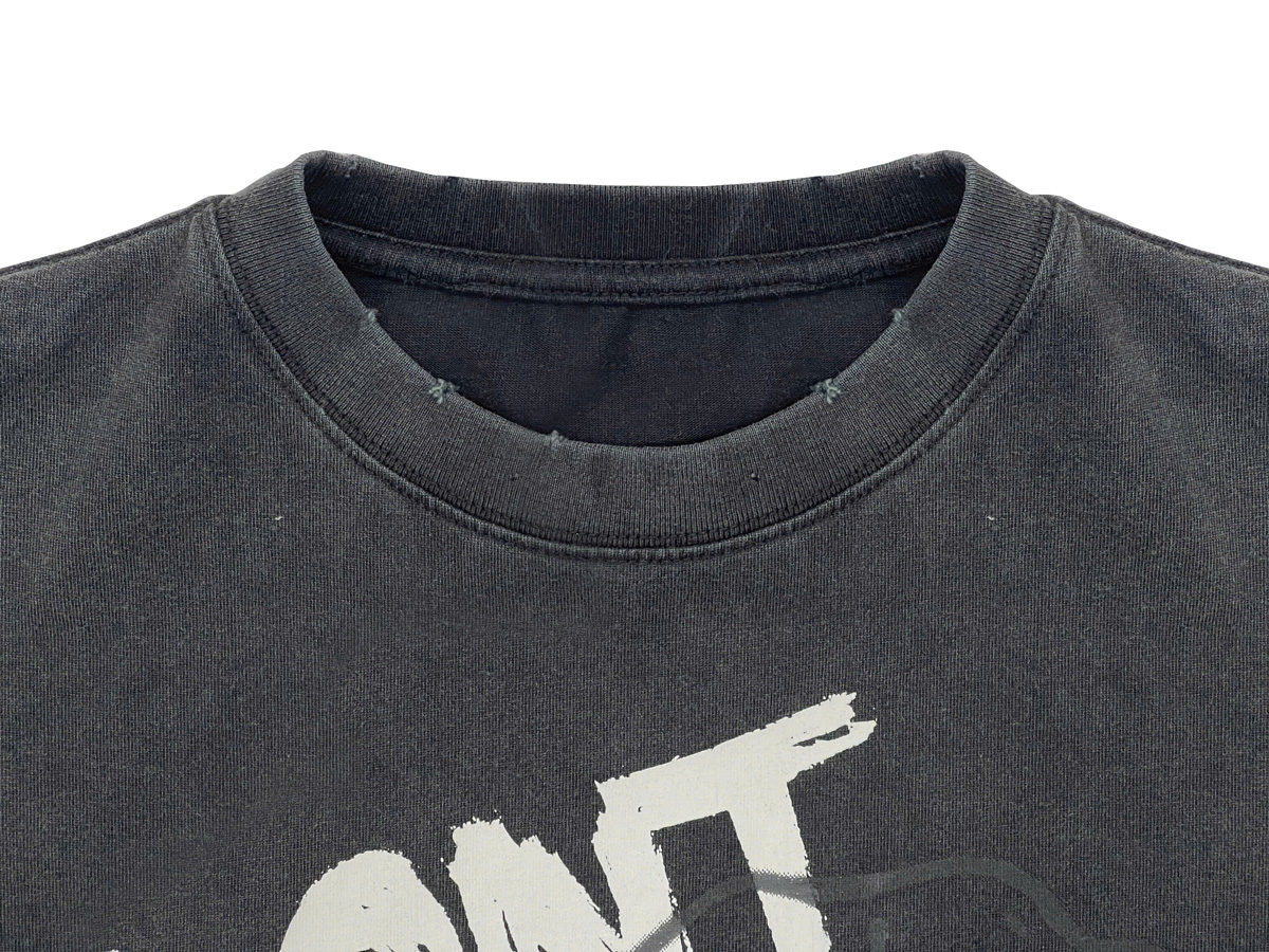 The collar is designed with a distressed effect, adding a bold and edgy touch that enhances the rugged streetwear aesthetic. 