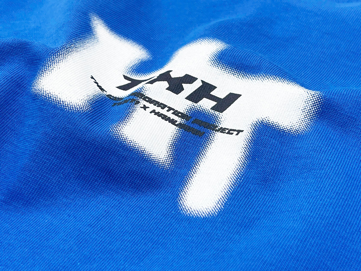The “HT” logo is printed with a fade or spray effect