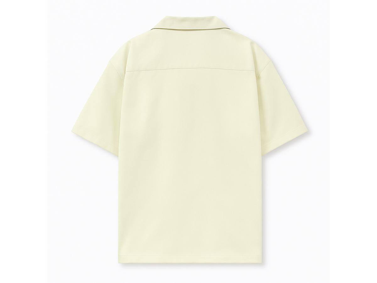 The back of the shirt embraces a clean, minimalist aesthetic, offering a visual balance to the embroidered front.