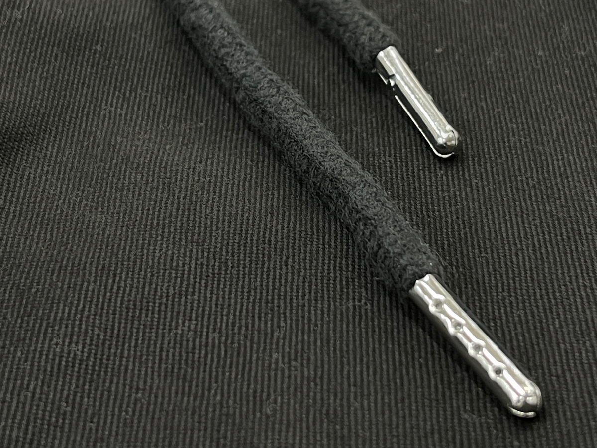 Soft cotton round drawcord with metal aglets ensures durability and keeps its shape over time.